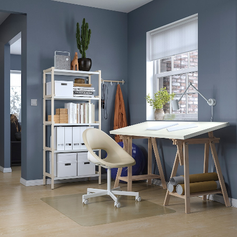 An art work table in a dark blue office