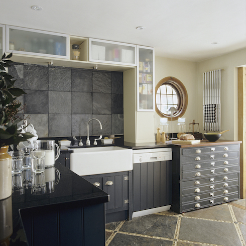 1950s timber framed Edwardian style country house with a two storey oak frame kitchen extension with large dark grey slate backsplash tiles