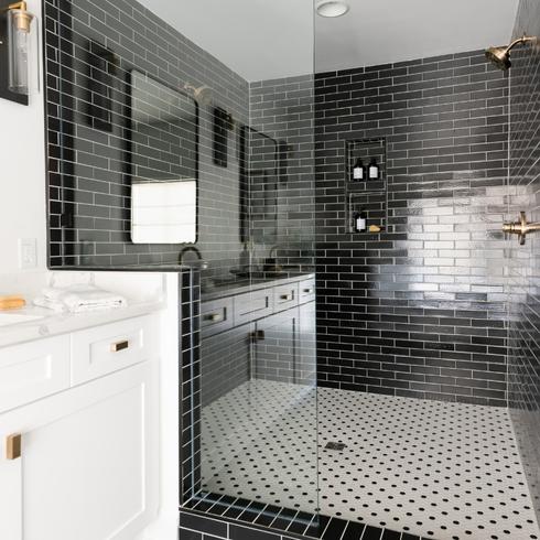 Black subway tile in walk-in shower