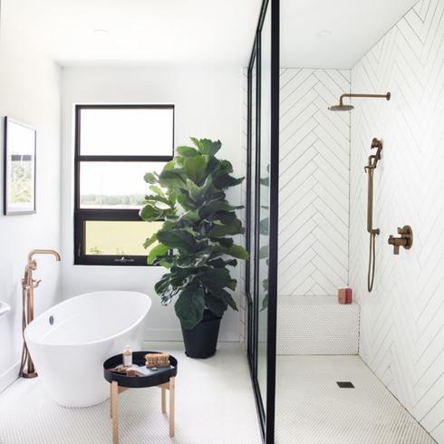 A walk-in shower design in black and white