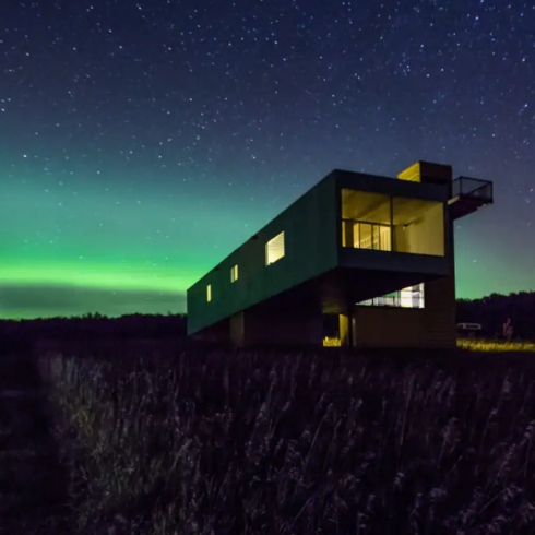 Shipping container Airbnb under Northern Lights