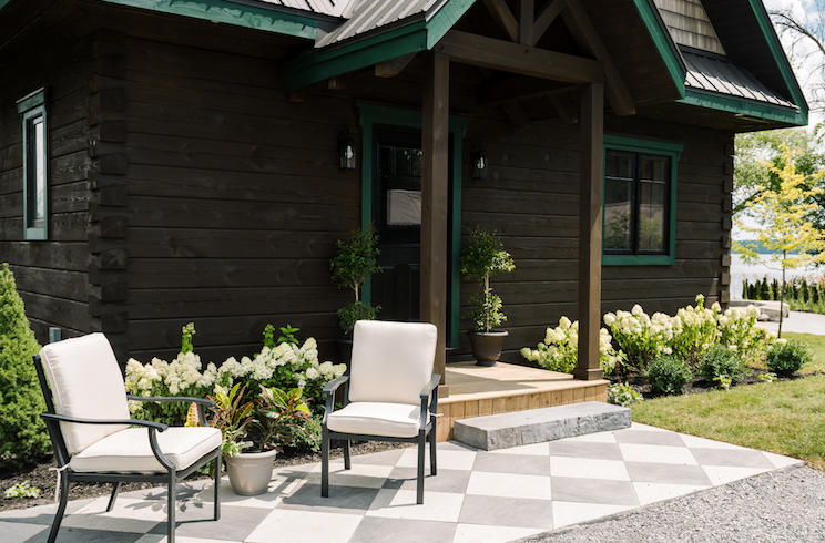 Ontario cabin with white hydrangeas in the garden