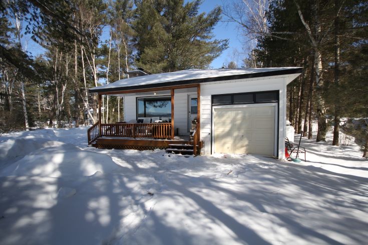 Outdated cottage façade with awkward garage