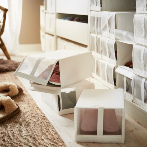 Shoe boxes in an organized hallway