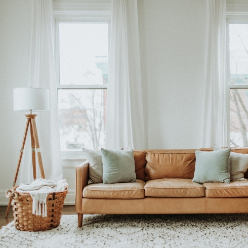 Leather couch in a white room