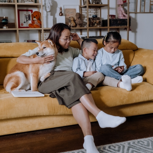 Mom and two children on a couch