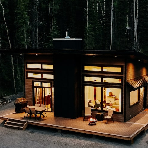 A cozy coal cabin lit up at nighttime