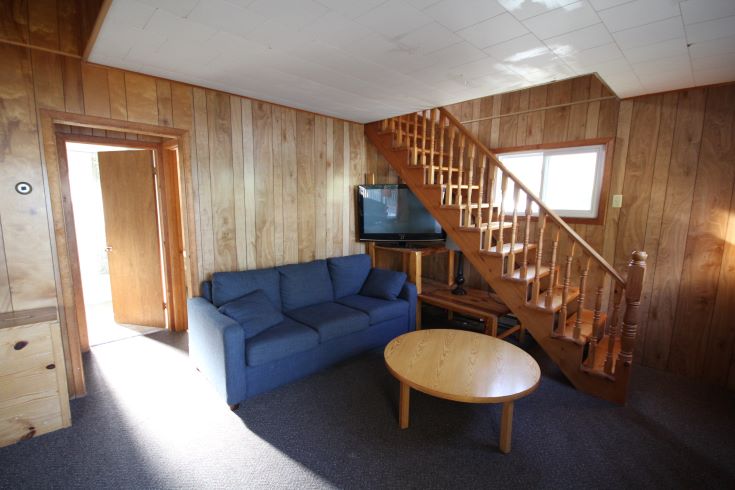 dated, rundown interior full of wood paneling 