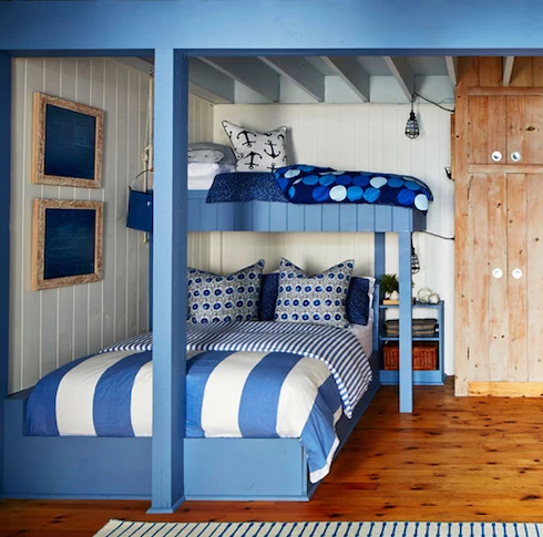 Amazing cottage kids’ bedroom by Home Network designer Sarah Richardson featuring blue and white built in bunkbeds