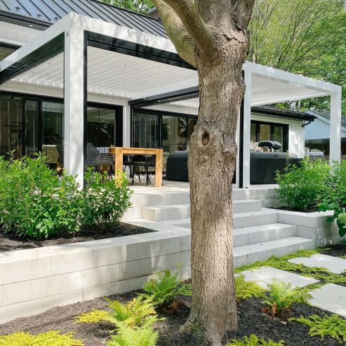 Elevated patio area in contemporary backyard