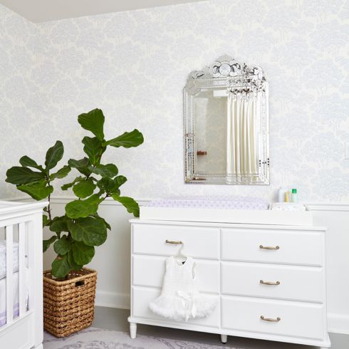 Mirror over dresser in nursery