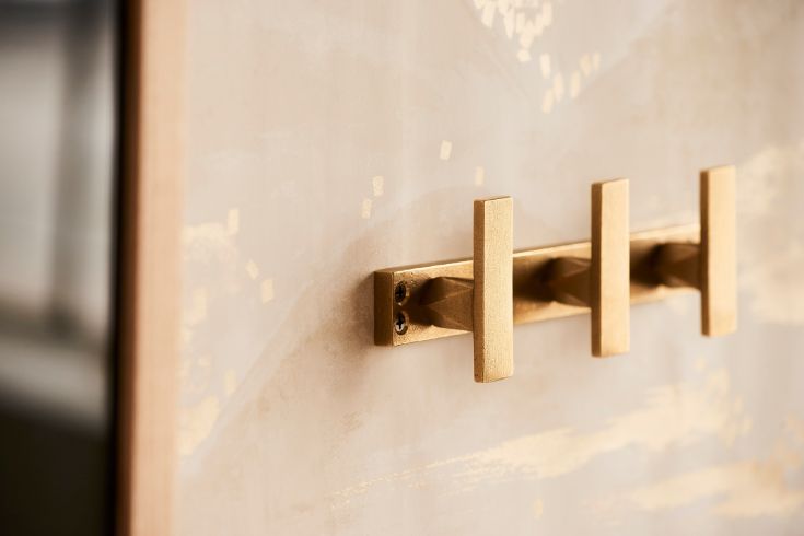 Shayne Harware brass GEO hooks on wall