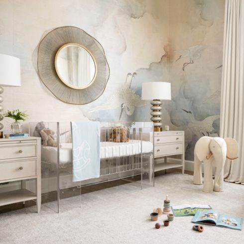 Modern neutral baby boy's nursery with soft blue accents