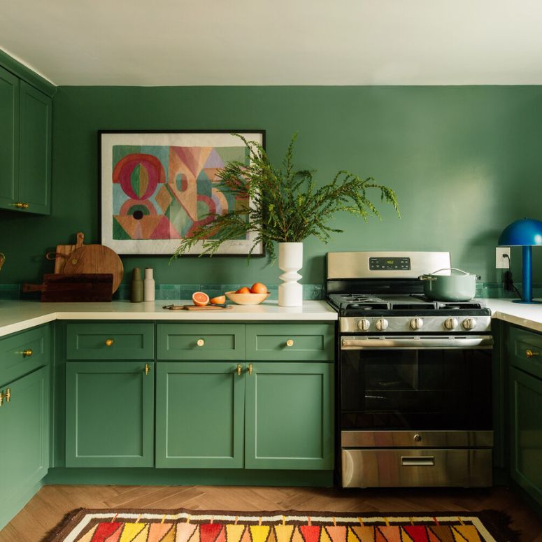 Green kitchen with green painted walls