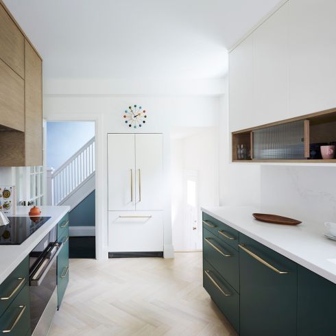 Green base cabinets in kitchen