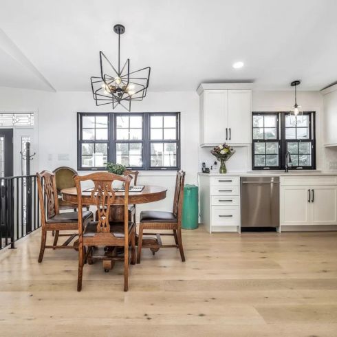 Gorgeous renovated home in Lethbridge, Alberta with modern white kitchen and light wood floors