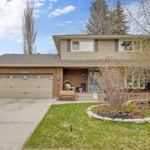 detached luxury home with beige brick in Calgary, Alberta