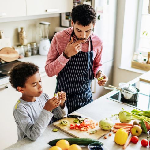 Dad and son cooking in the kitchen