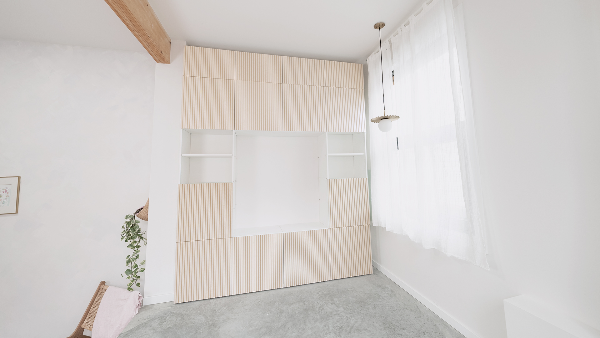 A wall of pink cabinets.