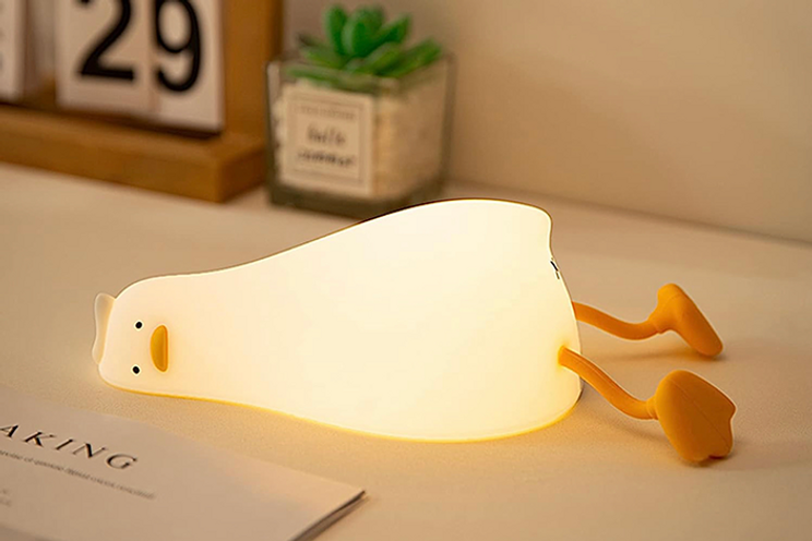 duck-shaped lamp on desk