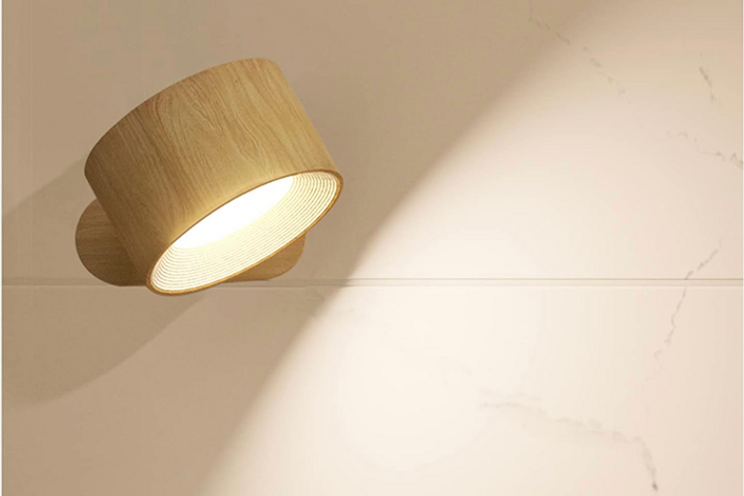 wood-style magnetic LED wall sconce on wall