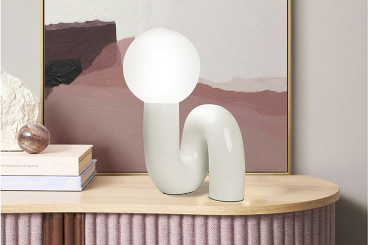 Art Deco inspired table lamp with modern swerve design