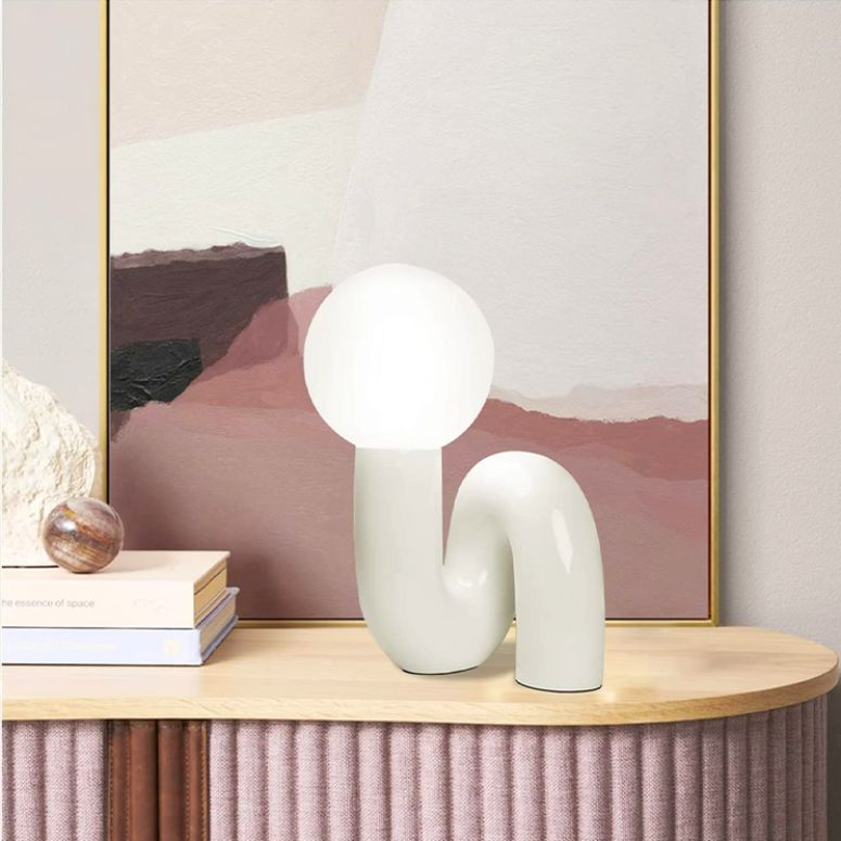 Art Deco inspired table lamp with modern swerve design