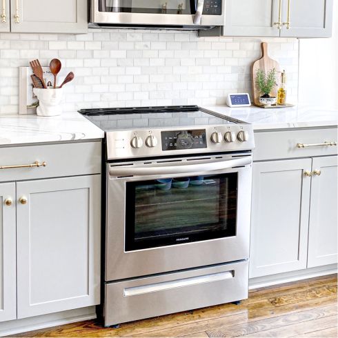 modern kitchen with stainless steel oven