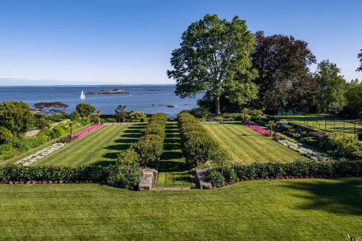 Walled gardens with hedges and flowers overlooking the ocean