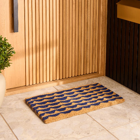 Marimekko blue patterned doormat in front of a modern porch