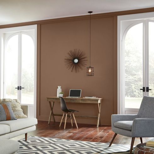 Modern living room with rich brown walls