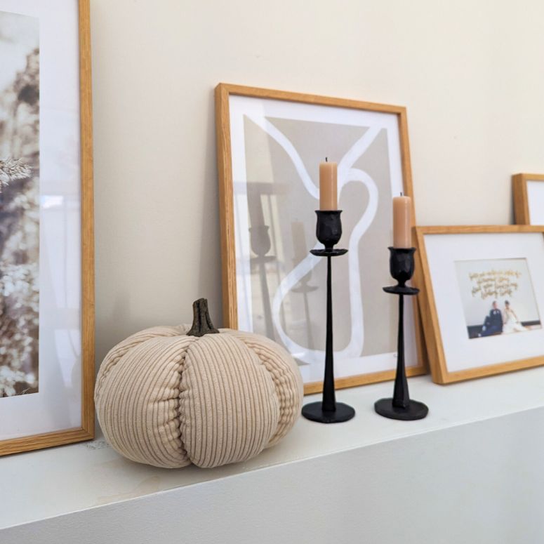 Fall decor on mantel with decorative faux fabric pumpkin