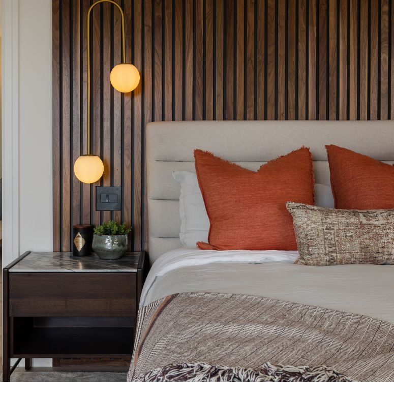 Bedroom with slatted walnut headboard