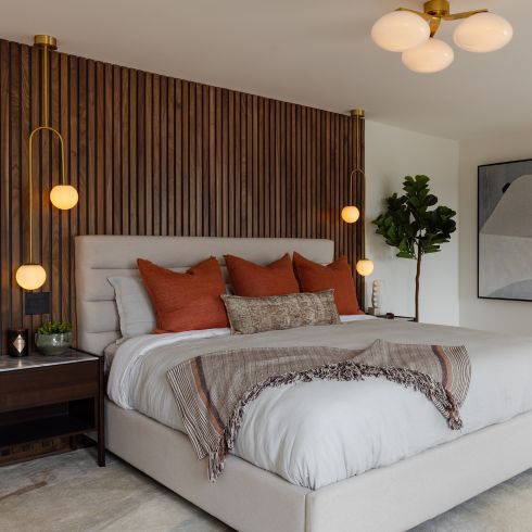 Bedroom with slatted walnut headboard