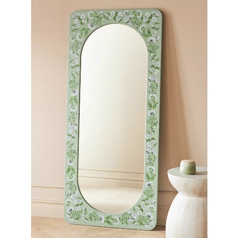 A beautiful painted floor mirror