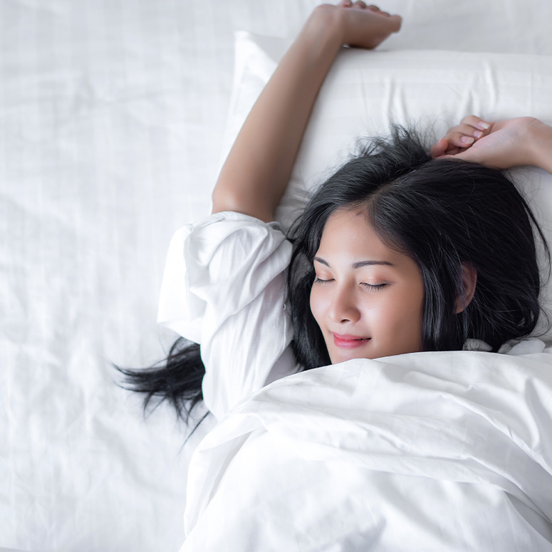 Woman sleeping on bed