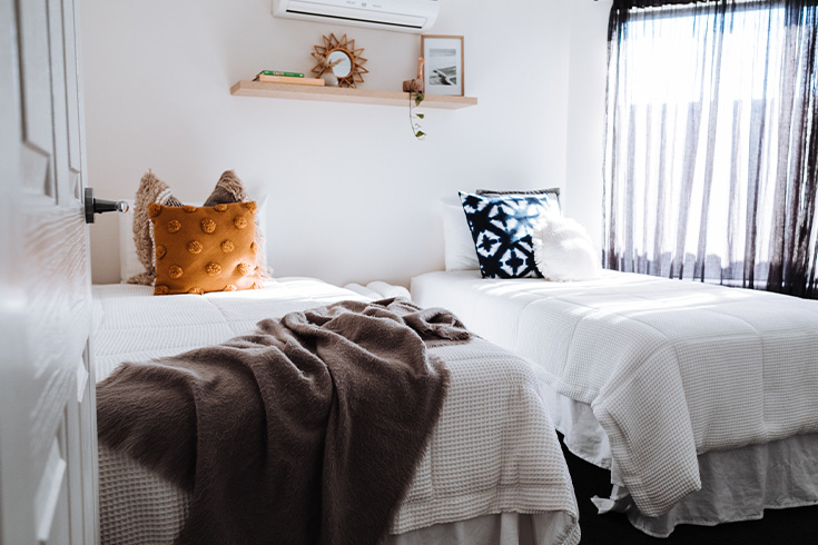 Two beds in small bedroom