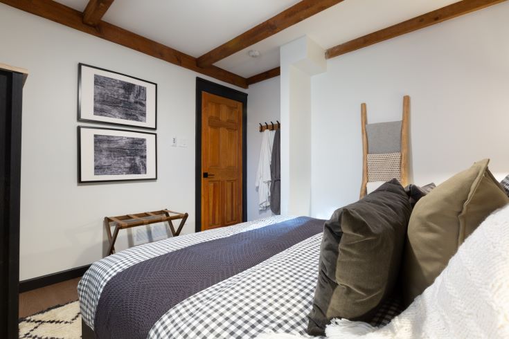 Spacious master bedroom with exposed beams