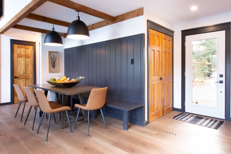 Stylish dining banquette with modern shiplap feature wall