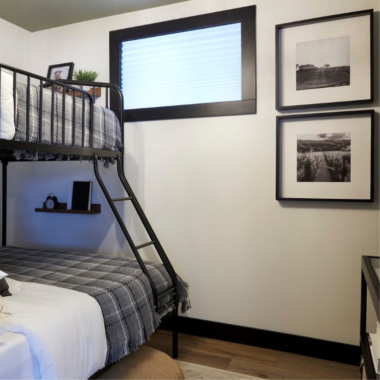 Bedroom with bunk bed and black floor trim