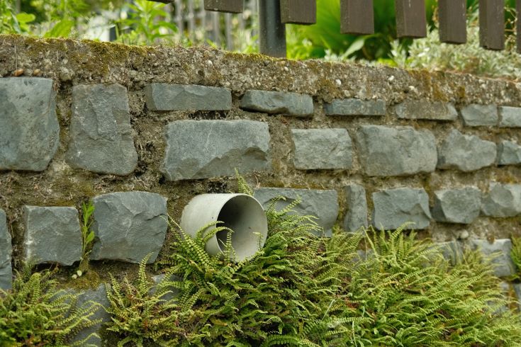 drainage pips sticking out of a foundation