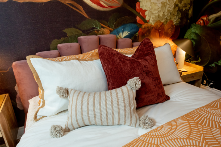 Bold bedding and headboard from Styled
