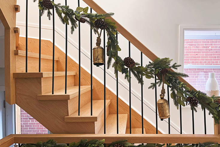 Dreamy farmhouse holiday decor on a home's staircase