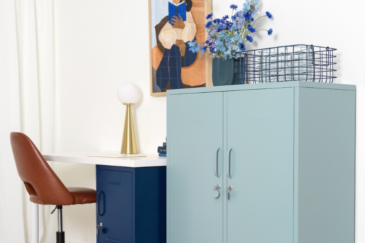 Two blue steel cabinets in an office.