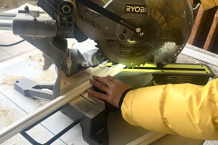Courtney Ryall measuring moulding