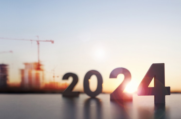 numbers showing 2024 in front of buildings under construction