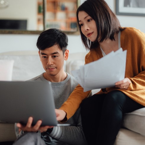 Couple looking at insurance documents