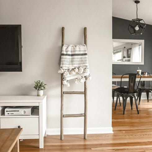 Shot of living room and dining room with light hardwood flooring