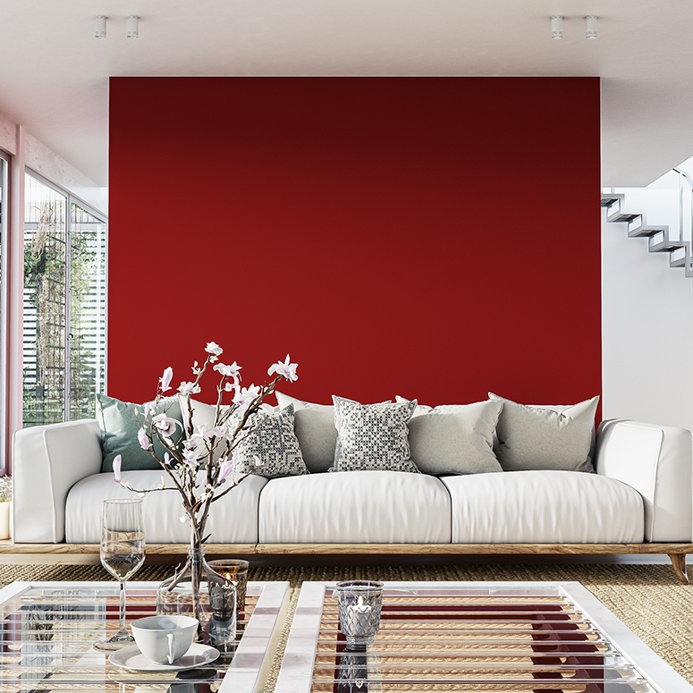 Cozy, luxurious, and empty modern living room with two beige textile sofas, a cozy chair, and decoration (pillows, blankets) on the hardwood floor in front of a blank red plaster wall background with copy space. A low coffee table in front of the sofa with decorations, glasses, coffee cups, and a vase of flowers. Large sliding windows with a terrace and garden view (chairs, tables, and trees) on both sides of the room. An aluminum modern staircase leads to the upper floor in the background. A slight vintage effect was added. 3D rendered image.