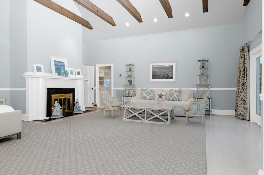 Large open concept basement with beams
